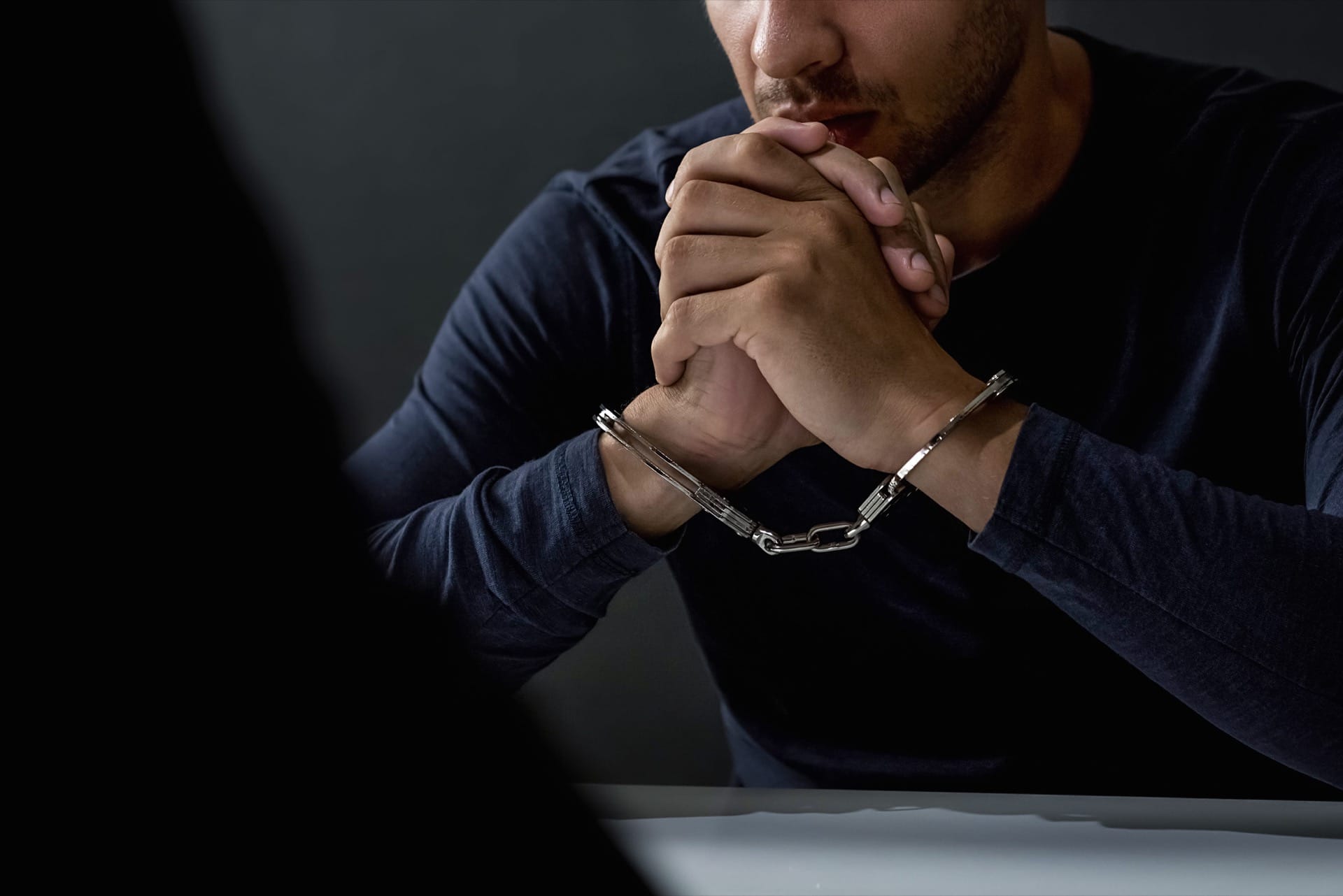 Photo of a Man in Handcuffs