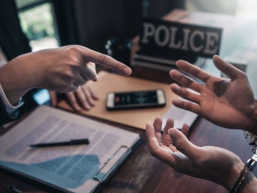 One Person pointing to another